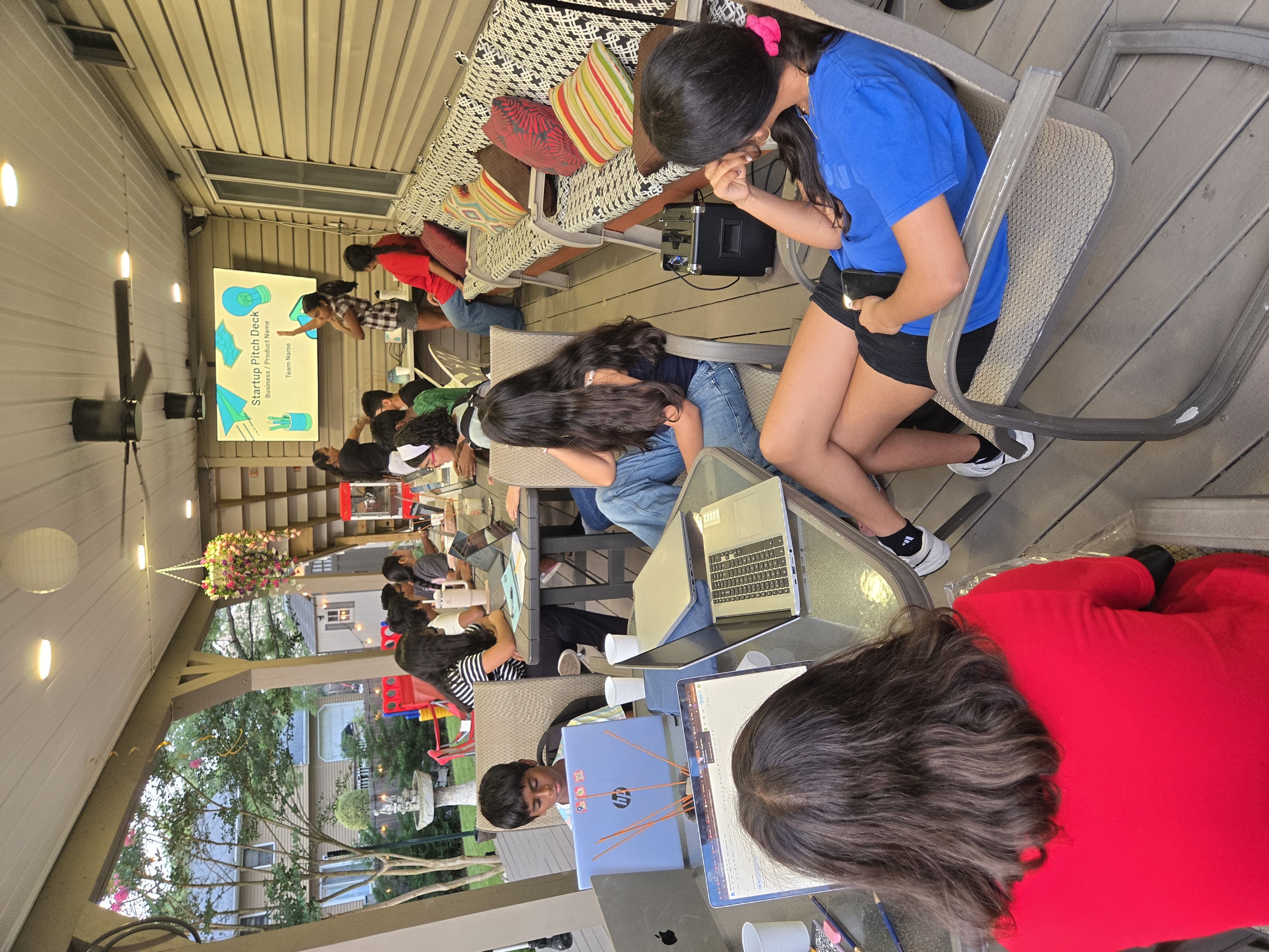 Students presenting a startup pitch deck